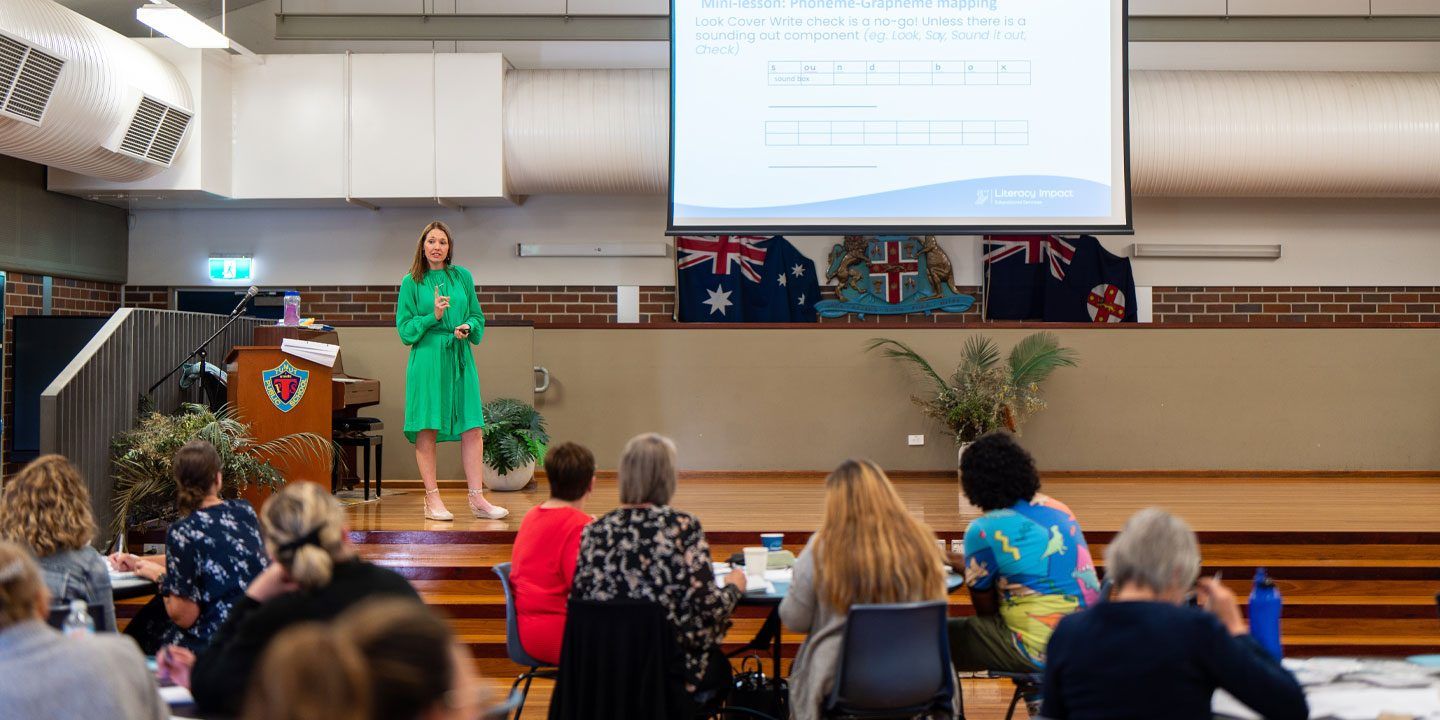 Julie Scali delivering a literacy keynote at researchED