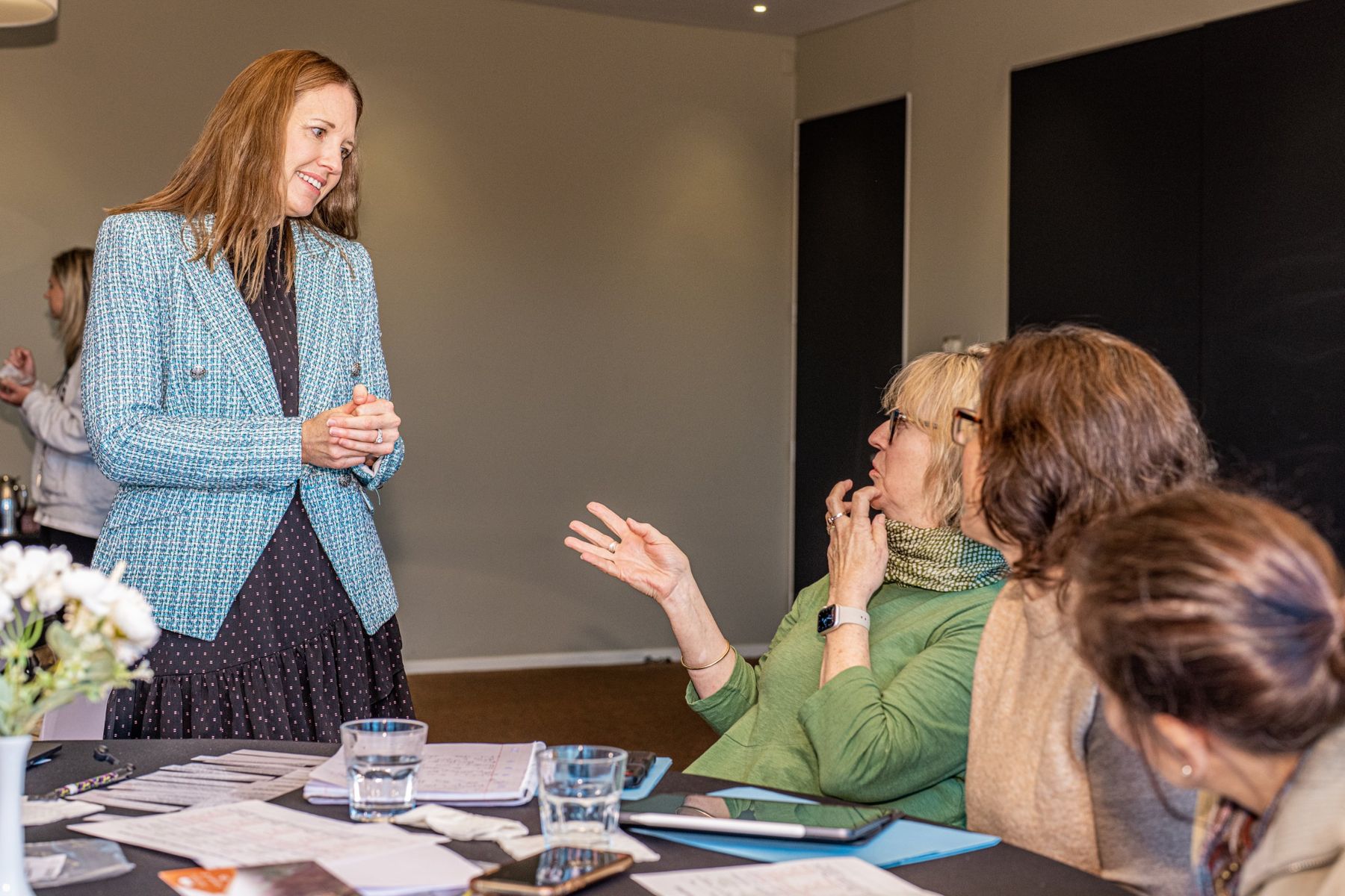 Julie Scali talking with school leaders during a literacy workshop